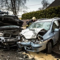 Car accident on a road in March 21, 2019, cars after frontal collision between BMW and Chevrolet in Riga, Latvia.